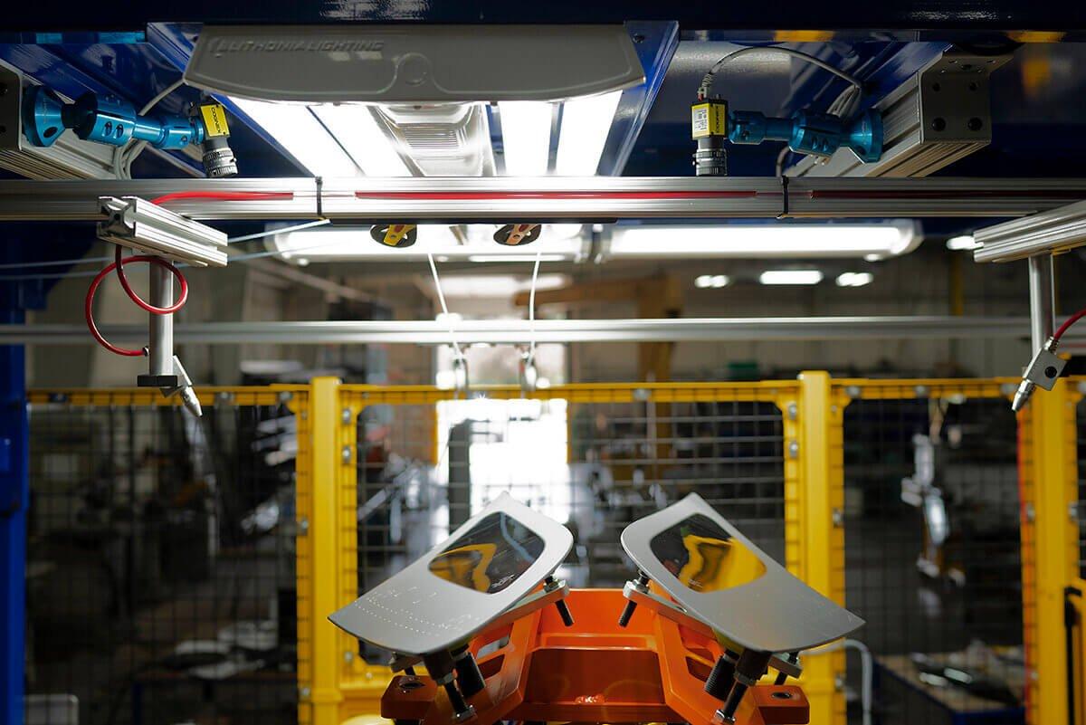 hil-man automation robot holding side windows